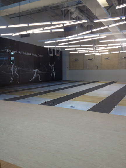 The new fencing training room was named after longtime coach Dave Micahnik.