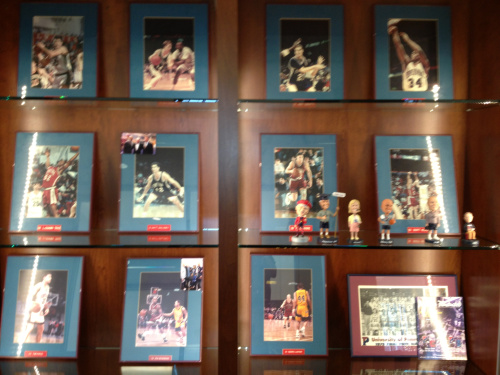 Some photos – and bobbleheads! – are already decorating the shelves outside the offices.