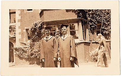 Roommates Sui-Lin Hsu and Carl Barchfield in their caps and gowns in the Quad.