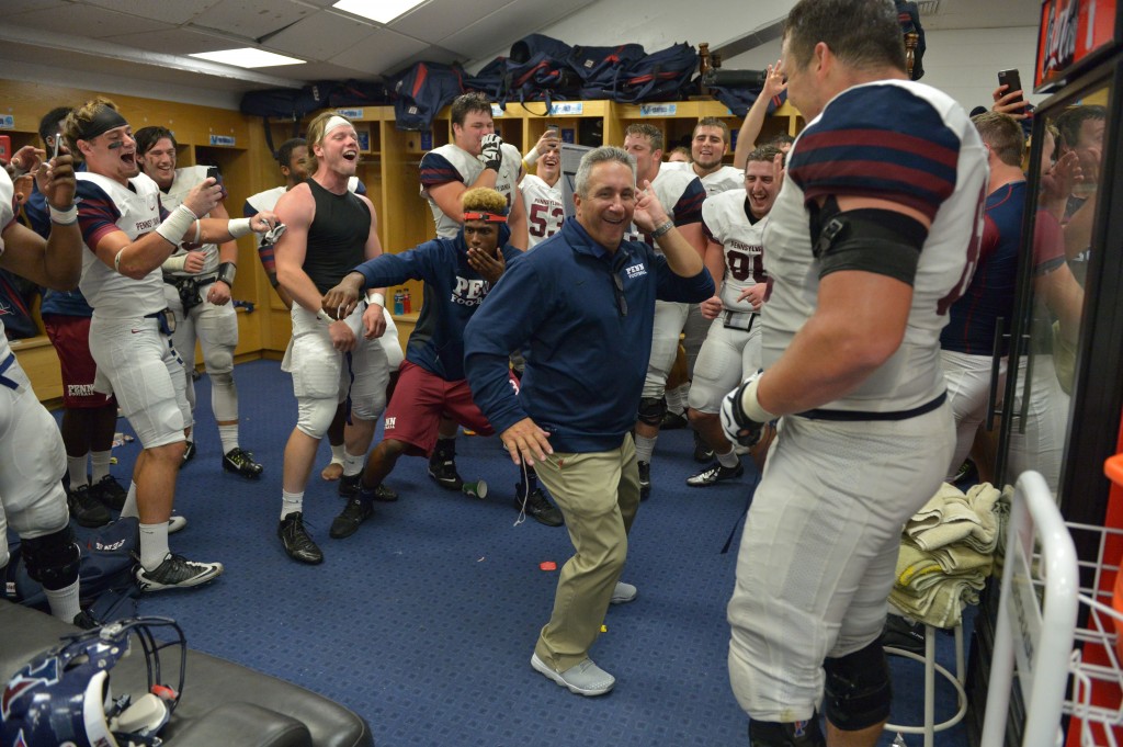 Penn head coach Ray Priore dances in the locker room after the Quakers' win Thursday (Penn Athletics).