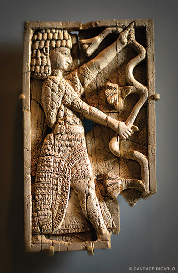 Ivory furniture plaque, eighth century BCE, probably used to decorate a chair or couch.