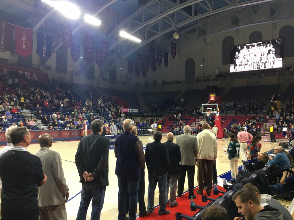 Members of the 1977-78 team watch a highlight video of their historic season.