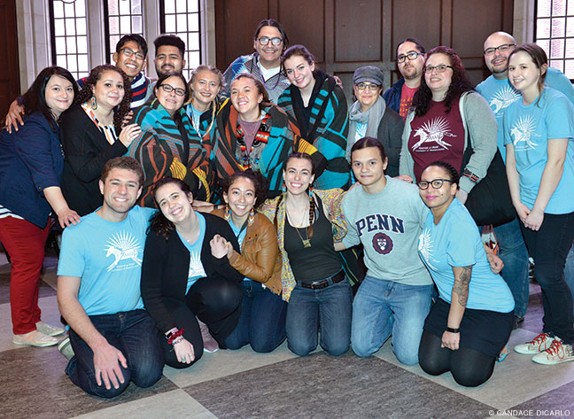 Photo of NAP students, alums, and mentors pose for a photo during this year’s Powwow at Houston Hall. 