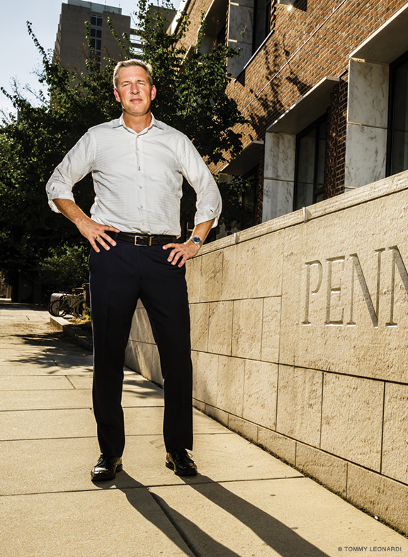 Photo of John Hollway standing outside of Penn's law school