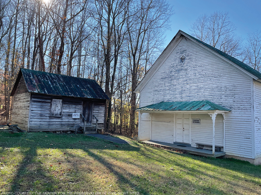 Photo of two wooden structures at the Snow Camp historic site in Alamance County, North Carolina