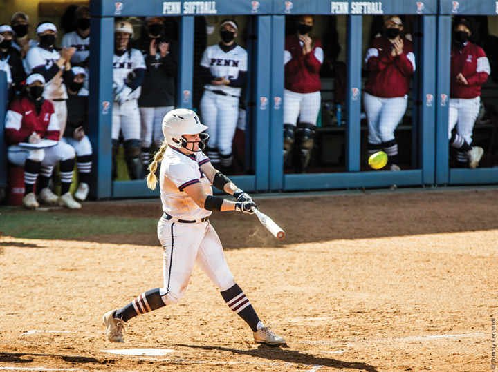 Photo of Emma Nedley connecting on a three-run home run during Penn’s softball doubleheader sweep of St. Joe’s on April 3. 