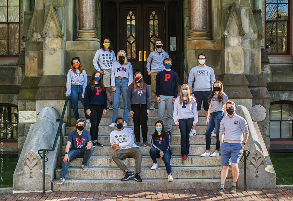 Photo of the board members of the Penn Glee Club and Penn Sirens on the steps of College Hall.