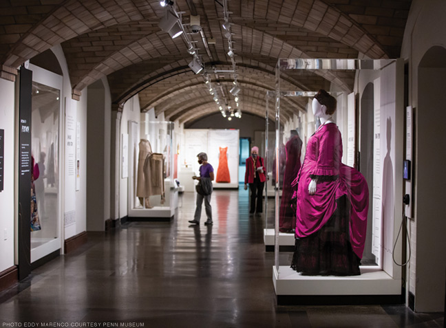 Photo of exhibition showing Eric Jaffe costume from the parody Thweeney Todd: The Flaming Barber of Fleek Street, and in the background a Grace Kelly dress.