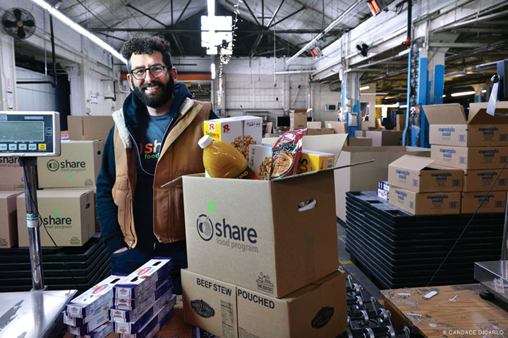 Photo of George Matysik in the Share Food Program's warehouse