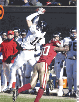 Penn football player goes up for the catch