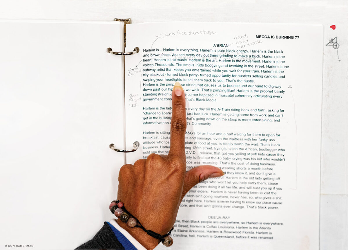 photo of woman's hand pointing to words in a script