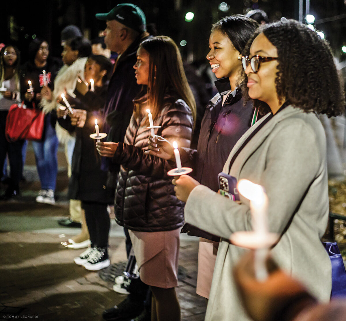 photo of people attending a candlight vigil commemorating Martin Luther King Jr.